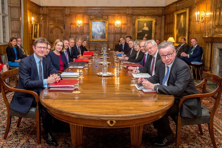 Theresa May poses with members of the EUXT (SN) sub-Committee on February 22, 2018 in Aylesbury, England.