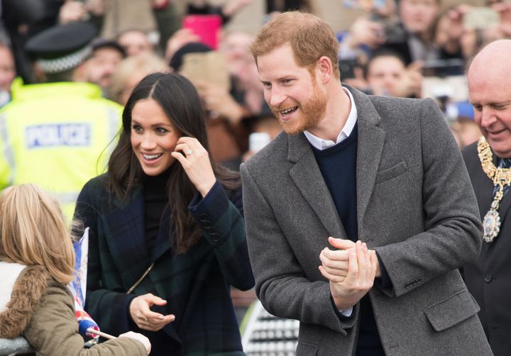 Meghan Markle and Prince Harry greet fans on their way to Edinburgh Castle on Feb. 13. Markle gave one Filipino woman a particularly memorable greeting during the visit.