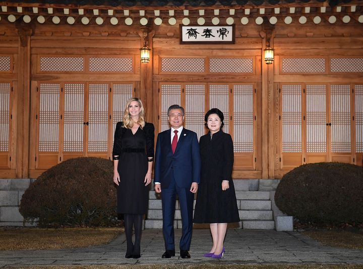 South Korean President Moon Jae-In (C), his wife Kim Jung-Sook (R) and Ivanka Trump (L) pose for photograph during their dinner at the Presidential Blue House on February 23, 2018 in Seoul, South Korea. 
