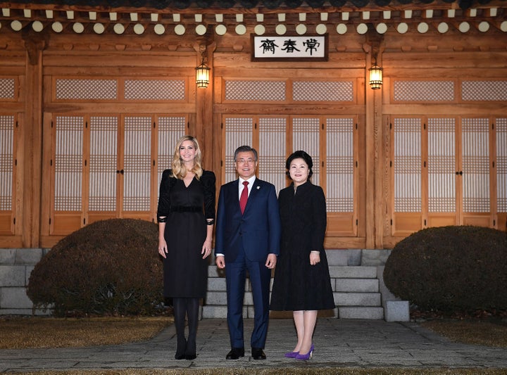 South Korean President Moon Jae-In (C), his wife Kim Jung-Sook (R) and Ivanka Trump (L) pose for photograph during their dinn
