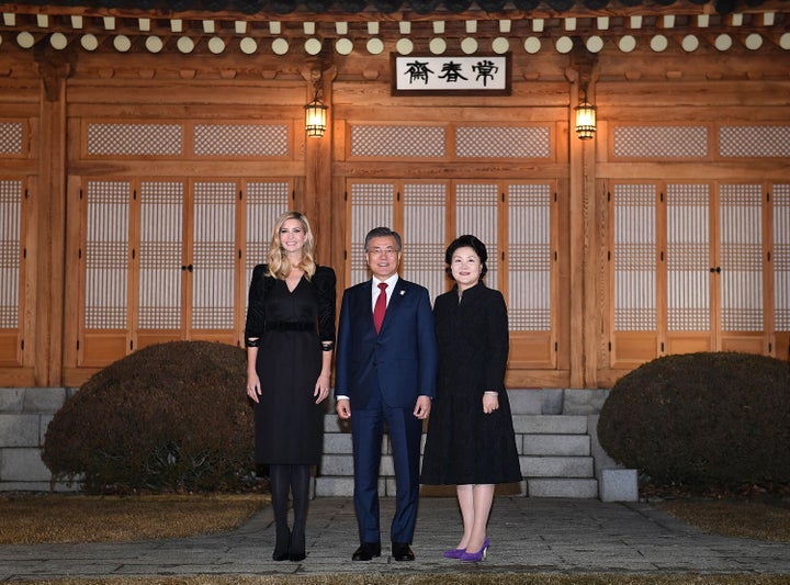 South Korean President Moon Jae-In (C), his wife Kim Jung-Sook (R) and Ivanka Trump (L) pose for photograph during their dinner at the Presidential Blue House on February 23, 2018 in Seoul, South Korea. 