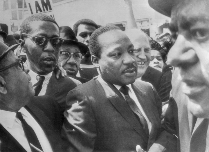 Dr. Martin Luther King Jr. is surrounded by leaders of the striking sanitation workers in Memphis in 1968.