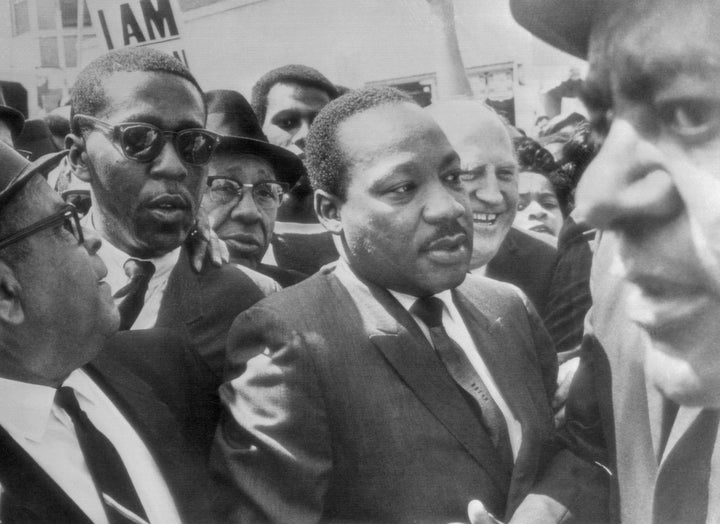 Dr. Martin Luther King Jr. is surrounded by leaders of the striking sanitation workers in Memphis in 1968.