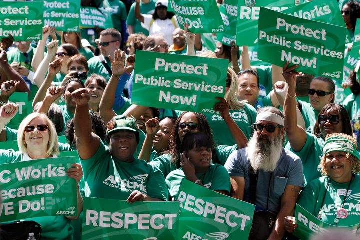 Union members cheer during a AFSCME rally at MacArthur Park in Los Angeles on June 20, 2012.