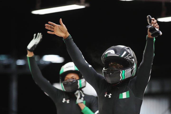 Seun Adigun and Akuoma Omeoga of Nigeria react in the finish area after competing during the Women's Bobsleigh heats on day twelve of the Pyeongchang 2018 Winter Olympic Games.