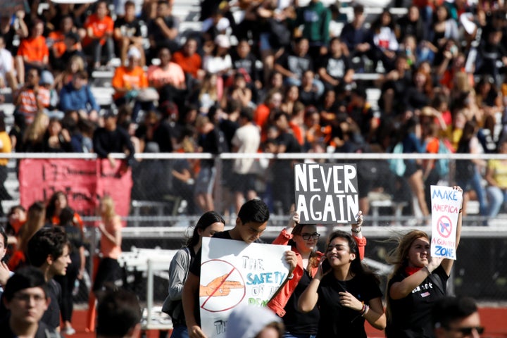 Students from Western High School in Davie, Florida, carrying placards, take part in a Feb. 21 protest in support of gun control following a mass shooting at nearby Marjory Stoneman Douglas High School.