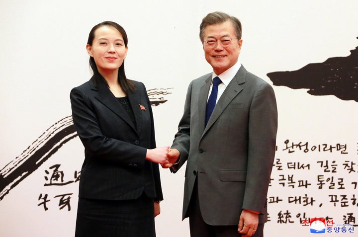 South Korean President Moon Jae-in shakes hands with Kim Yo Jong, the sister of North Korea's leader Kim Jong Un, in Seoul, S