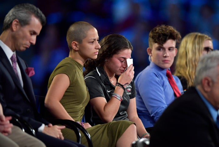 Marjory Stoneman Douglas High School student Emma Gonzalez comforts a classmate during a CNN town hall meeting on Wednesday, Feb. 21, 2018.