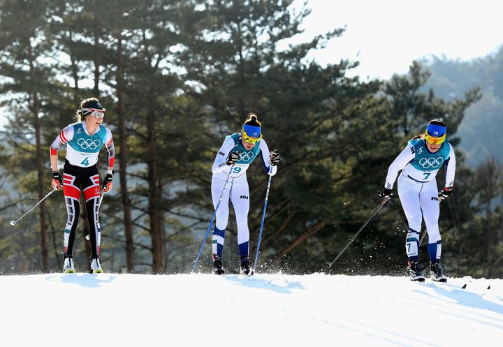 Teresa Stadlober of Austria is seen left of Kerttu Niskanen of Finland, center, and Krista Parmakoski of Finland during Sunday's 30-kilometer race.