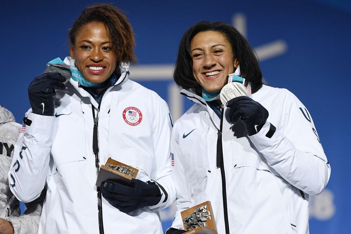 Silver medalists Lauren Gibbs and Elana Meyers Taylor of Team USA celebrate during the medal ceremony for Bobsleigh.