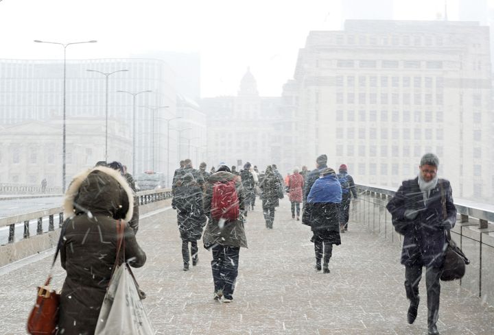 Commuters walking in the snow on London Bridge on Monday morning