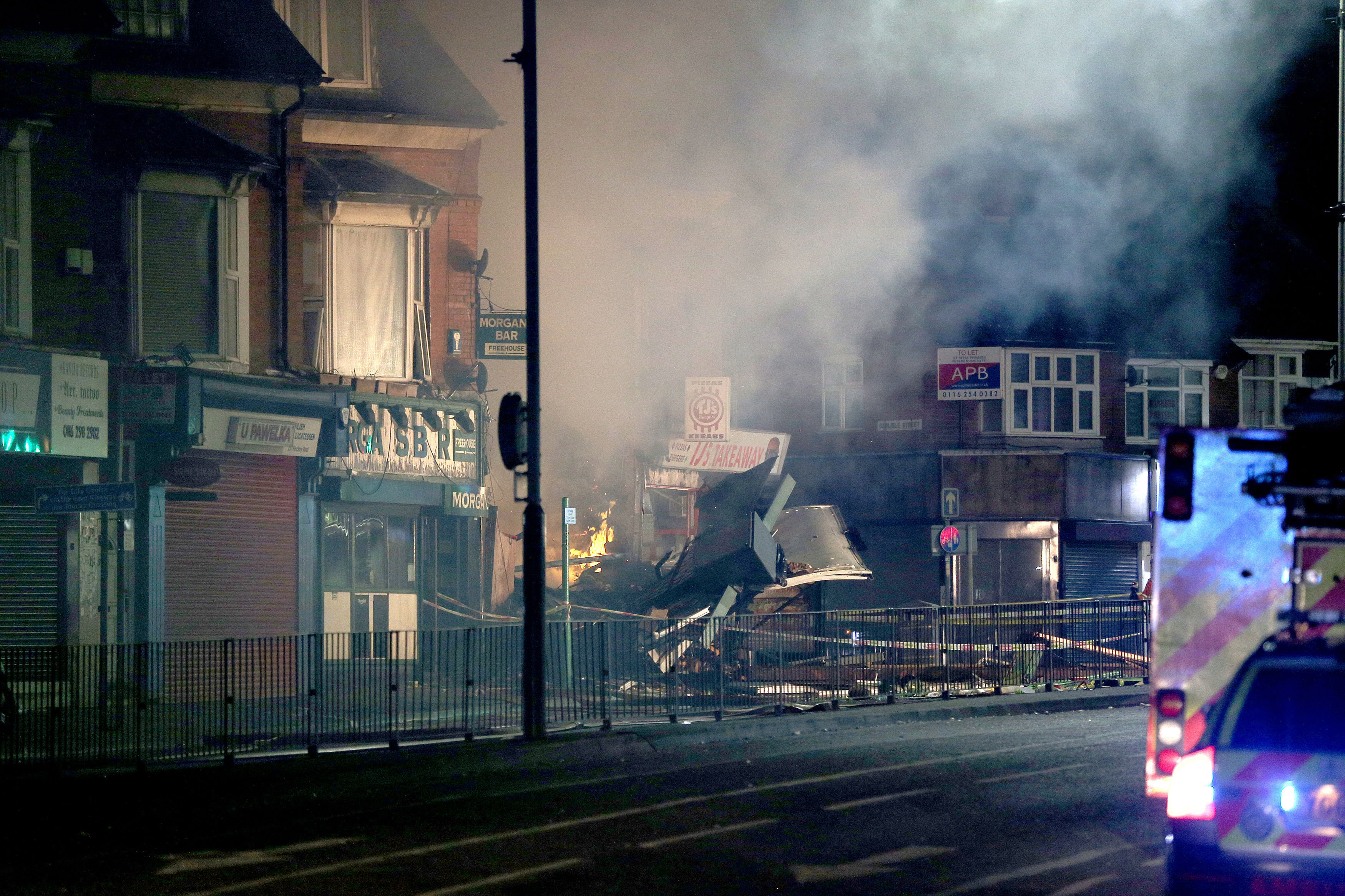 <strong>Smoke rises from the ruins of the building, as seen this morning.</strong>