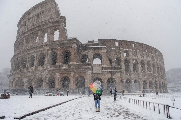 The white stuff didn't stop a few hardy souls from visiting the Colosseum.