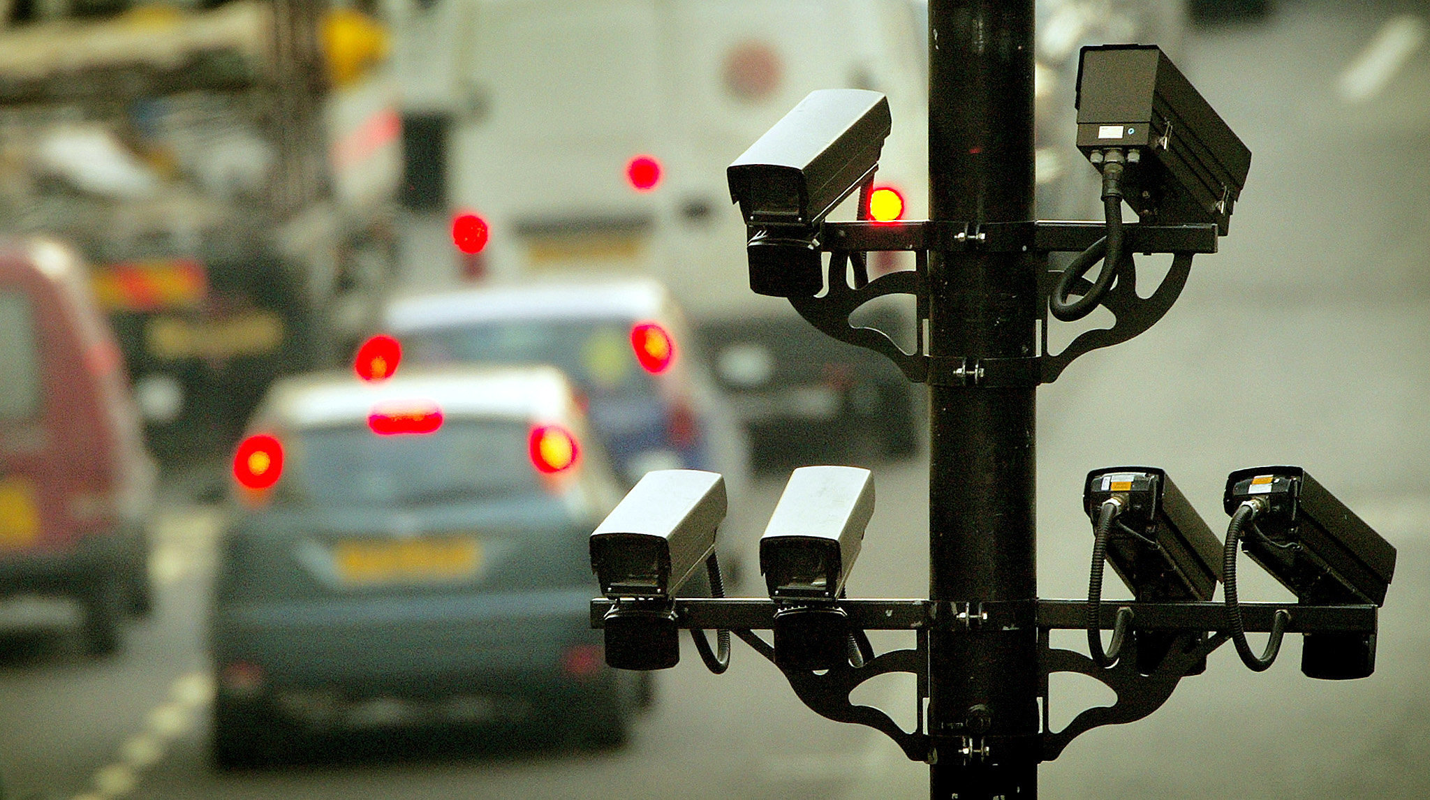 <strong>Target:&nbsp;Congestion charge number plate recognition CCTV cameras can be seen above traffic in central London</strong>