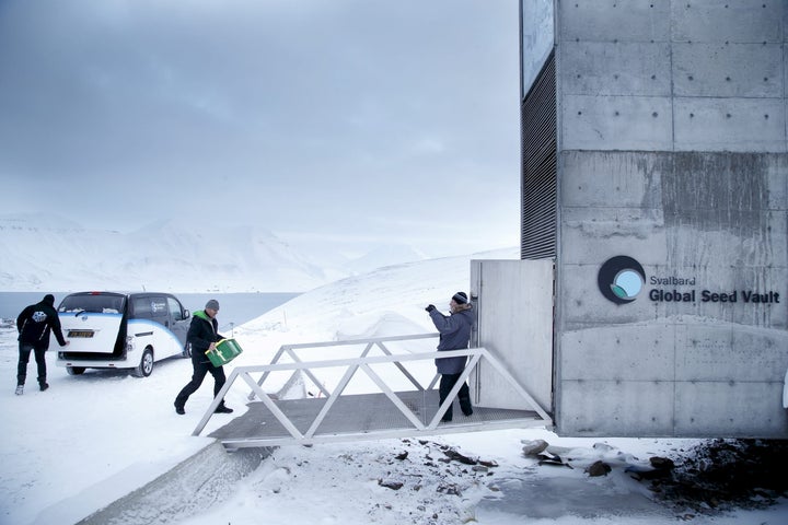 Boxes containing seeds from Japan and the U.S. are seen being carried into the seed vault in 2016.