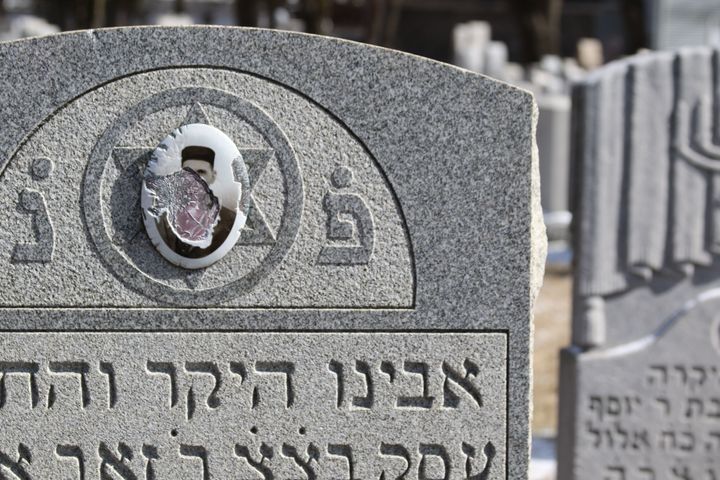 A vandalized headstone at Stone Road or Waad Hakolel Cemetery in Rochester, New York on March 3, 2017. Vandals defaced headstones at the Jewish cemetery, one of at least seven such cemeteries to be targeted by vandalism in 2017. 