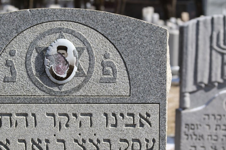 A vandalized headstone at Stone Road or Waad Hakolel Cemetery in Rochester, New York on March 3, 2017. Vandals defaced headstones at the Jewish cemetery, one of at least seven such cemeteries to be targeted by vandalism in 2017.