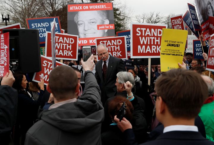Supporters cheer on Mark Janus, the plaintiff in a case that could lead to the gutting of public sector labor unions, after he spoke to them outside the Supreme Court on Feb. 26, 2018.