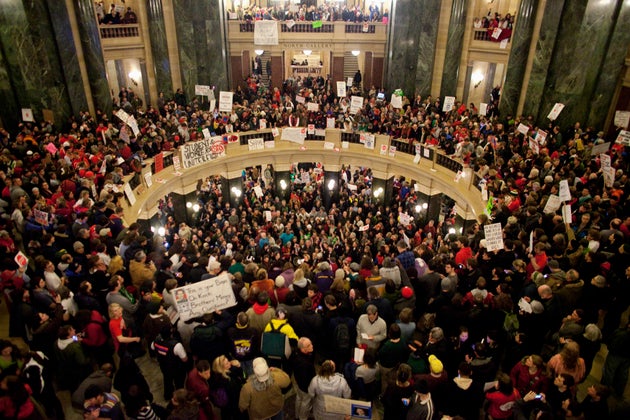 Protesters took over the Wisconsin state capitol building after Republicans voted to eliminate the state's...