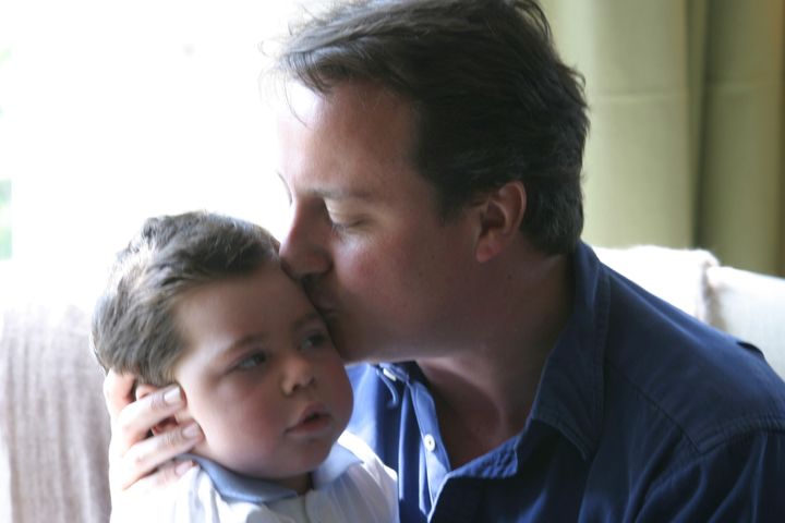 David Cameron with his son Ivan at their country home.