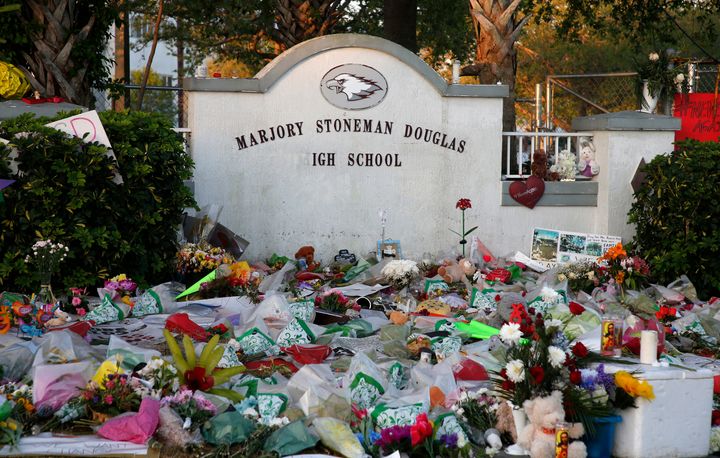 Flowers are seen outside Marjory Stoneman Douglas High School in Parkland, Florida, on Tuesday. School resumed on Wednesday.
