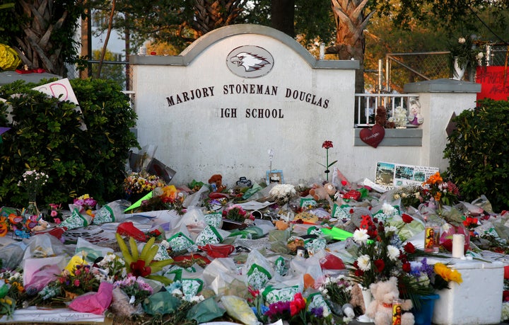 Flowers are seen outside Marjory Stoneman Douglas High School in Parkland, Florida, on Tuesday. School resumed on Wednesday.