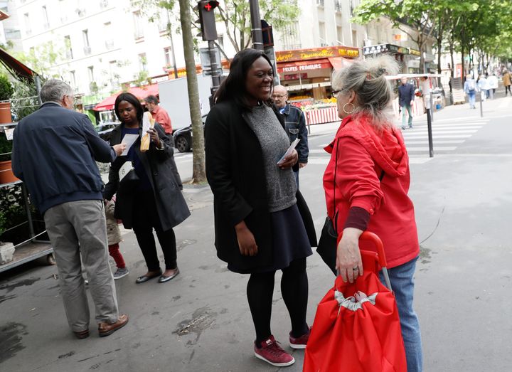 Laetitia Avia, a French politician, received a letter Wednesday full of racist slurs, plus a death threat. She's pictured here speaking to a woman while campaigning for the parliamentary elections in Paris on May 18, 2017.