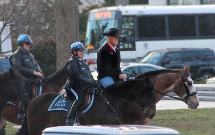 Interior Secretary Ryan Zinke rides a horse to his first day of work at the Interior Department on March 2, 2017.