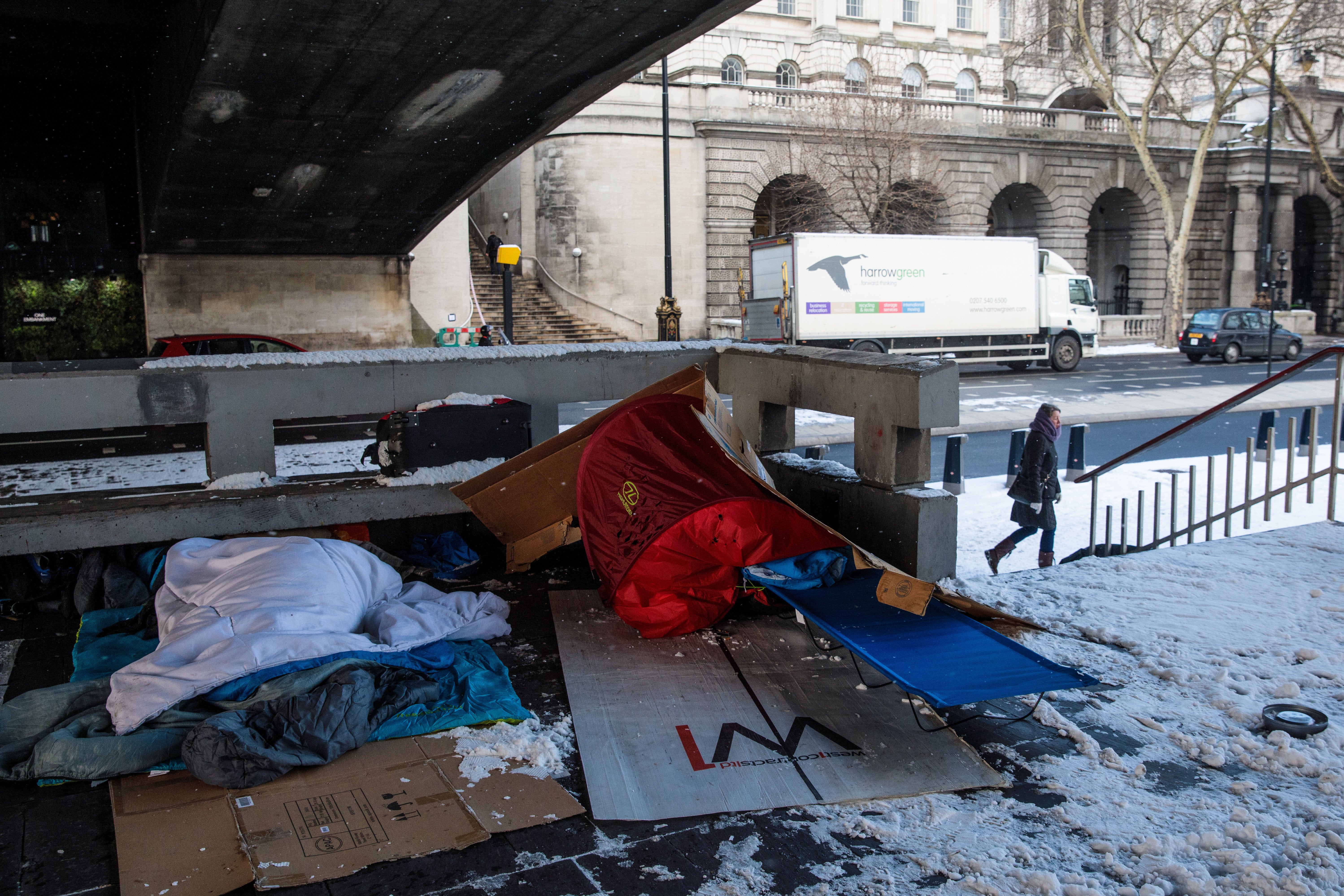 <strong>Bedding and shelters belonging to homeless people lie under a bridge on the Embankment in London.</strong>