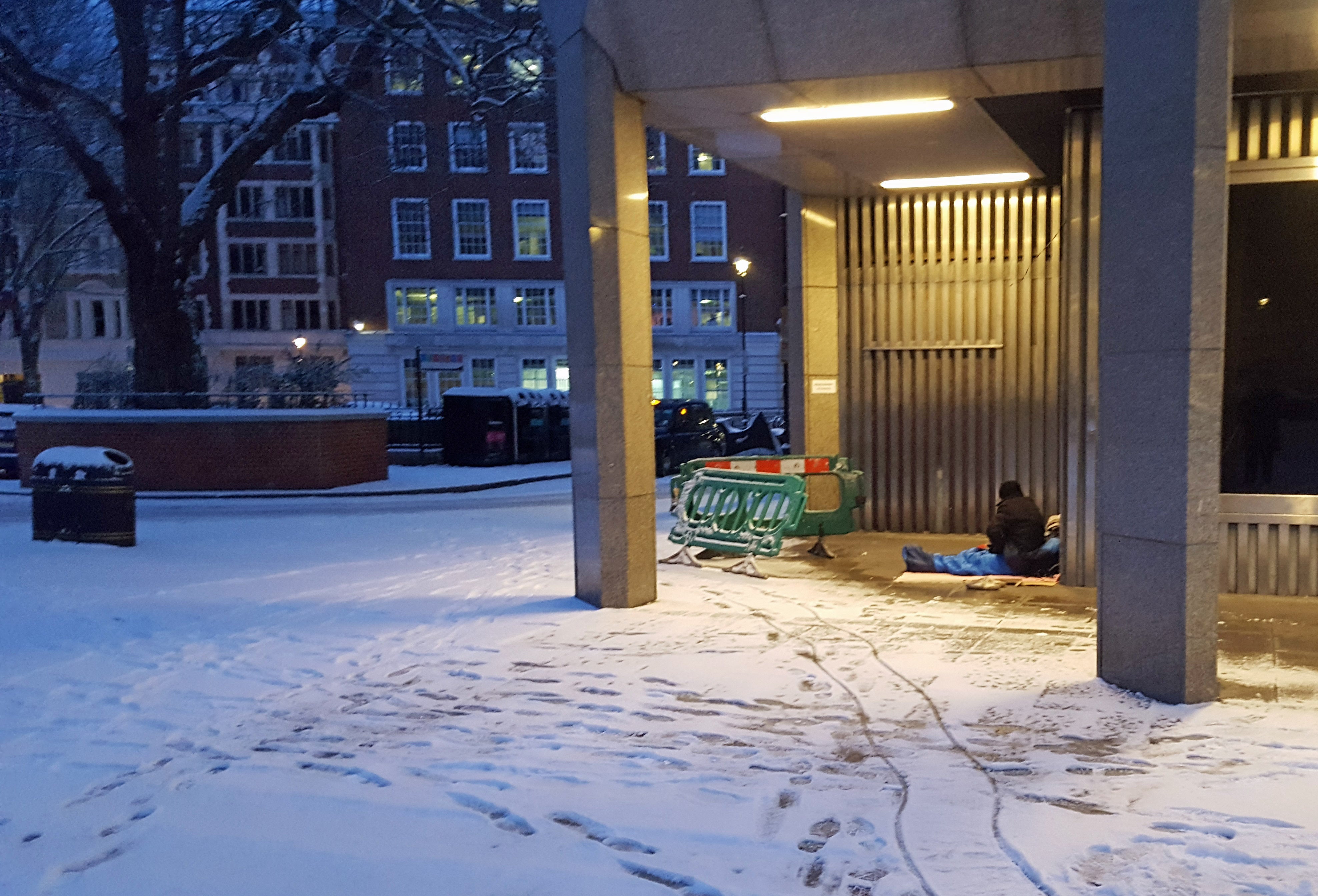 <strong>A homeless man sheltering near Westminster Cathedral in London.</strong>