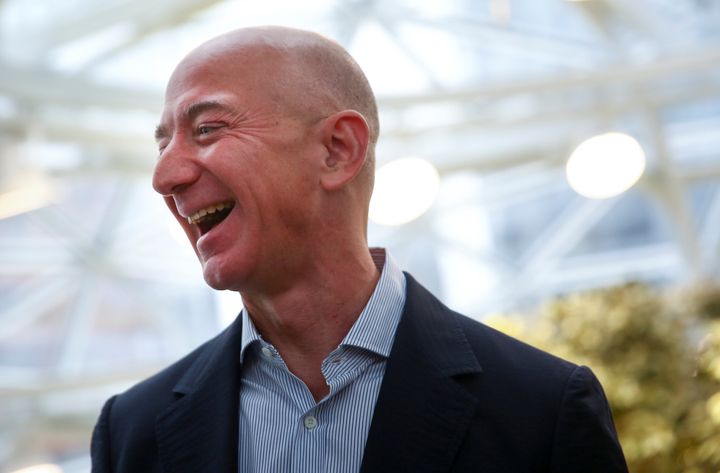 Amazon founder and CEO Jeff Bezos laughs as he talks to the media while touring the new Amazon Spheres during the grand opening at Amazon's Seattle headquarters in Seattle, Washington on January 29, 2018. (REUTERS/Lindsey Wasson)