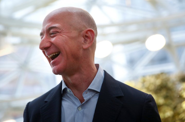 Amazon founder and CEO Jeff Bezos laughs as he talks to the media while touring the new Amazon Spheres during the grand opening at Amazon's Seattle headquarters in Seattle, Washington on January 29, 2018. (REUTERS/Lindsey Wasson)