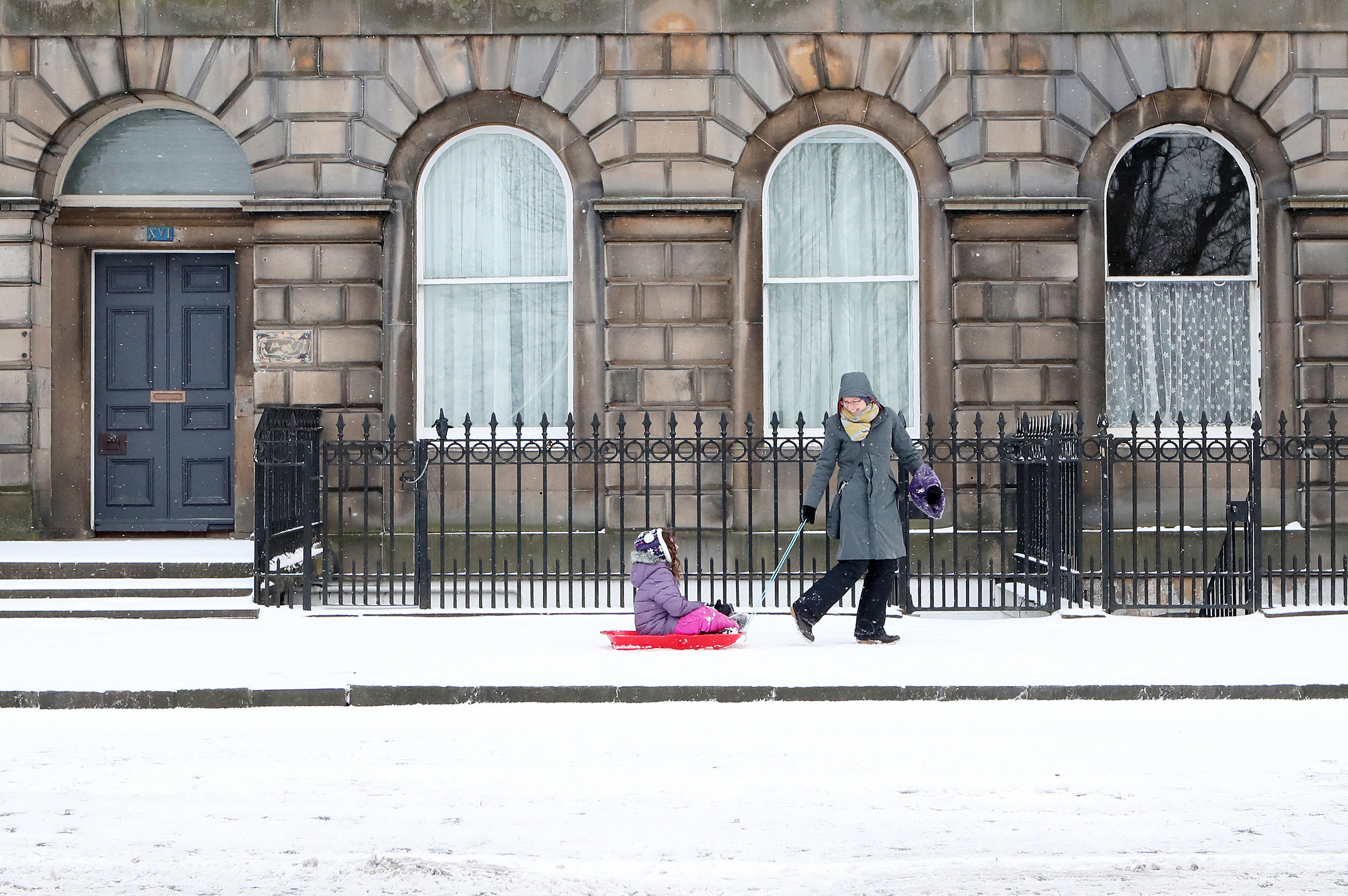 <strong>A child is pulled in a sledge along Royal Terrace in Edinburgh, as the 'Beast from the East' brings wintry weather and freezing temperatures to much of the country.&nbsp;</strong>