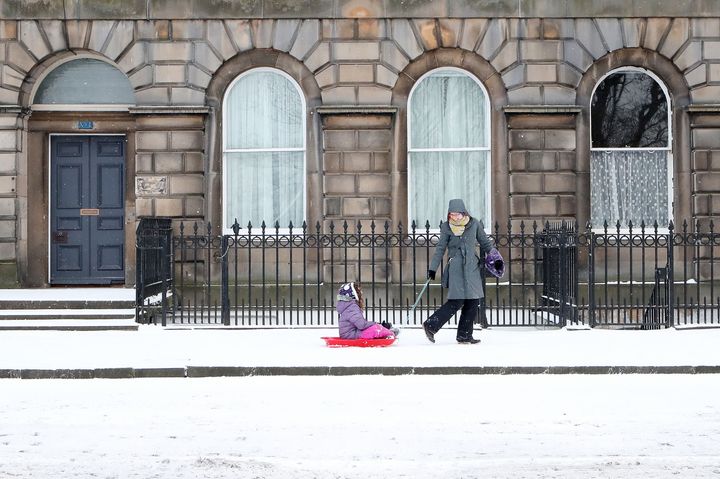 A child is pulled in a sledge along Royal Terrace in Edinburgh, as the 'Beast from the East' brings wintry weather and freezing temperatures to much of the country. 