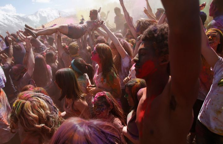  Participants crowd surf, dance and throw colored chalk during the Holi Festival of Colors at the Sri Sri Radha Krishna Temple in Spanish Fork, Utah, March 30, 2013.