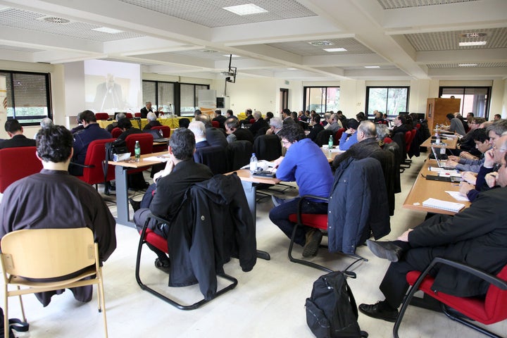 A teacher speaks to students during a course on exorcism at the Regina Apostolorum Pontifical Athene