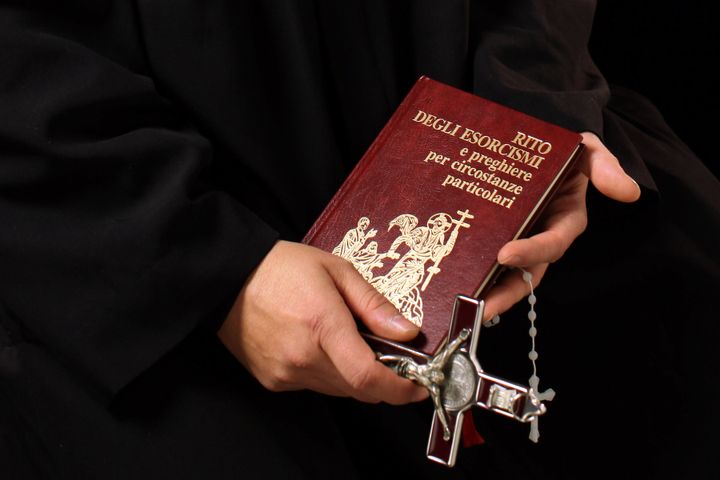 Don Aldo Buonaiuto holds items necessary for exorcisms on January 12, 2012, in Rome, Italy. 