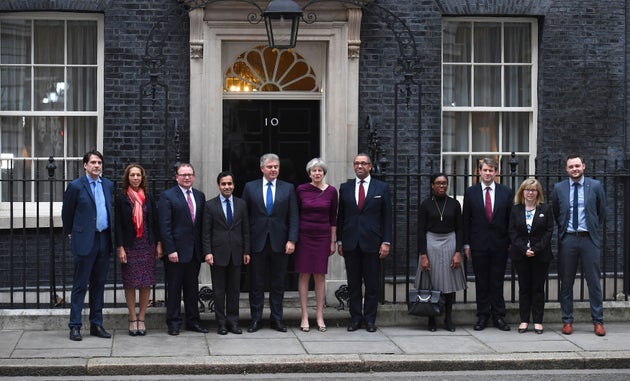 From left: CCHQ Vice Chair for Training and Development James Morris, CCHQ Vice Chair for Communities Helen Grant, CCHQ Vice Chair for Local Government Marcus Jones, CCHQ Vice Chair for Communities Rehman Chishti, Conservative Party Chairman Brandon Lewis, Prime Minister Theresa May, Conservative Deputy Chairman James Cleverly, CCHQ Vice Chairman for Candidates Kemi Badenoch, CCHQ Vice Chairman for Policy Chris Skidmore, CCHQ Vice Chair for Women Maria Caulfield and CCHQ Vice Chair for Youth Ben Bradley outside 10 Downing Street, London.