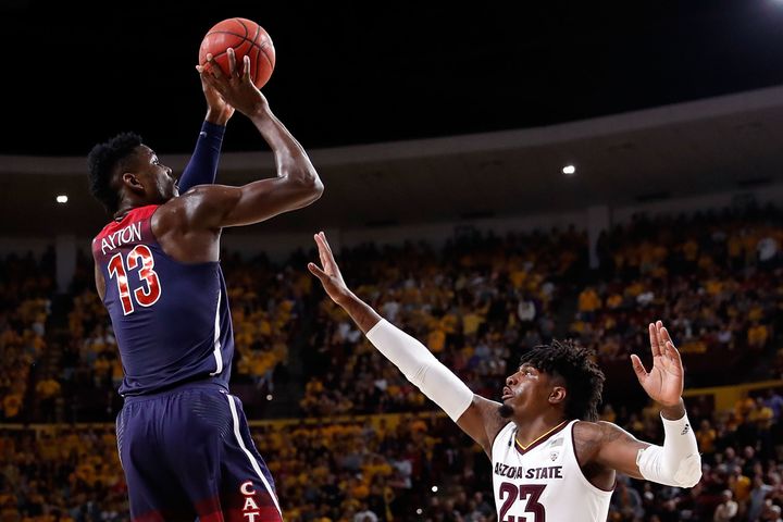 Deandre Ayton of the Arizona Wildcats, left, is at the center of accusations against coach Sean Miller.