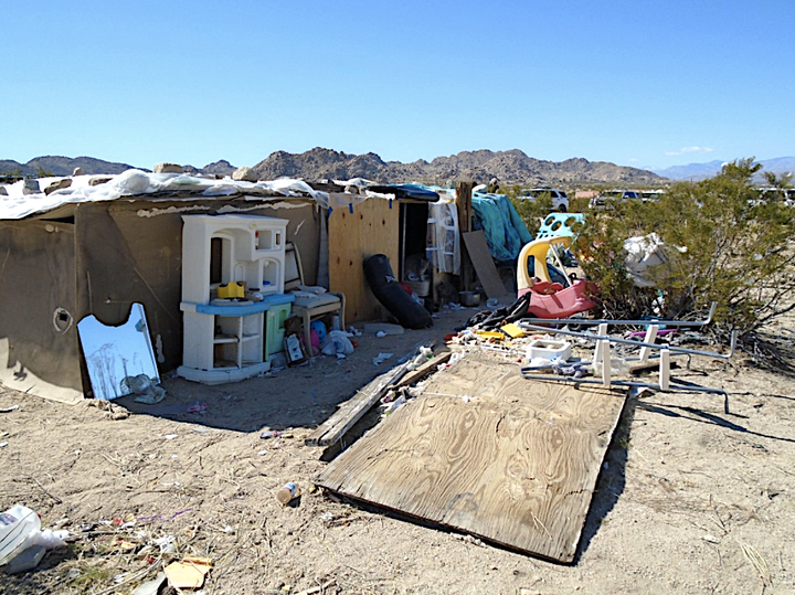 San Bernardino County sheriff’s deputies found a family living in a plywood box that was four feet high with no el
