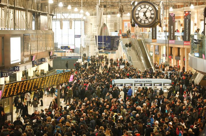 Commuters waited anxiously on the concourse of London's Waterloo station before its planned closure at 8pm on Friday