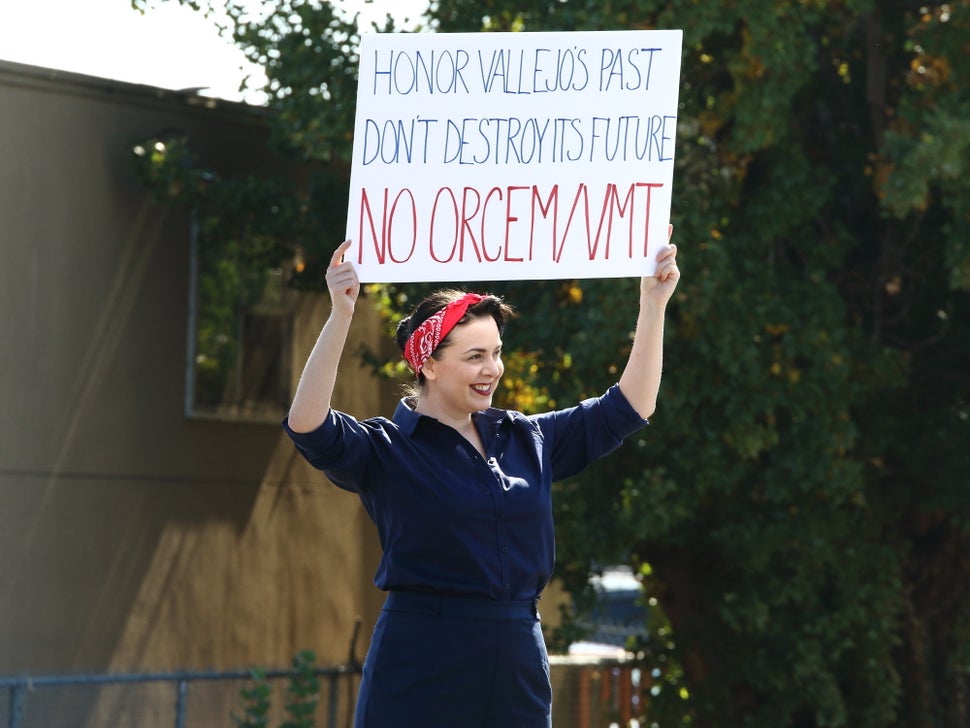 A protester holds up a banner at a rally in Vallejo, California, in October to oppose the proposed Orcem cemen