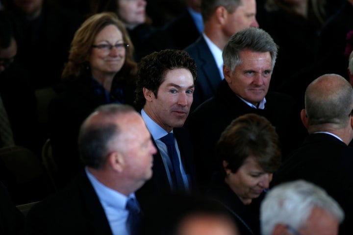 American televangelist Joel Osteen joins fellow mourners before the start of a funeral service for Rev. Billy Graham at the B
