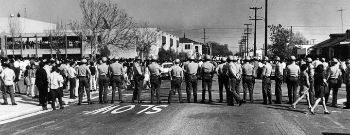 Sheriff's deputies form a line across street at Garfield High School in Los Angeles during a student demonstration on March 5, 1968. 