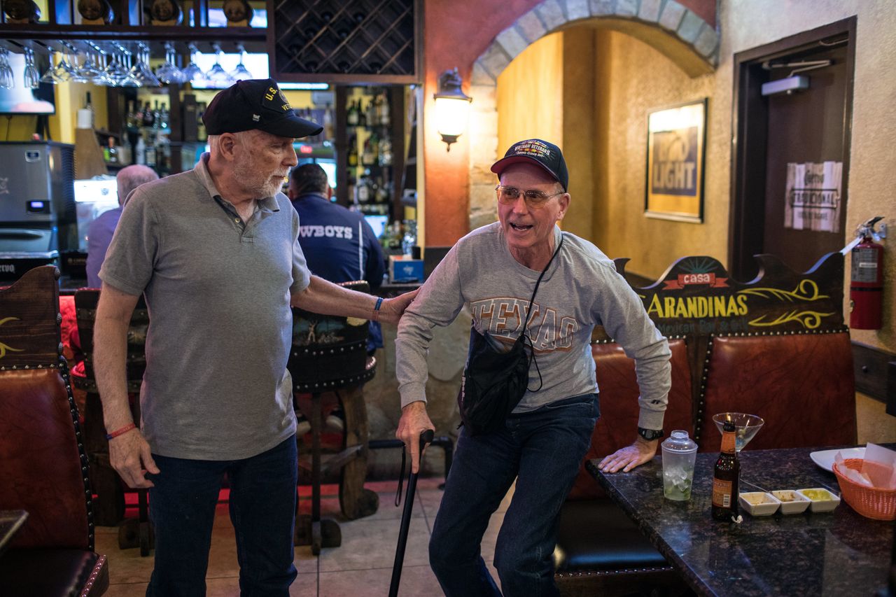 Richard Blakely helps Yarling stand up after dining together at a Mexican restaurant in Austin.
