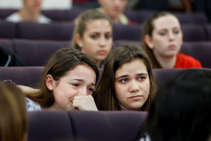 Marjory Stoneman Douglas High School student Alondra Gittelson (left) is comforted by schoolmate Bailey Feuerman after Gittleson spoke with leaders of the Florida Senate about changing laws controlling assault weapons on Feb. 21, 2018.