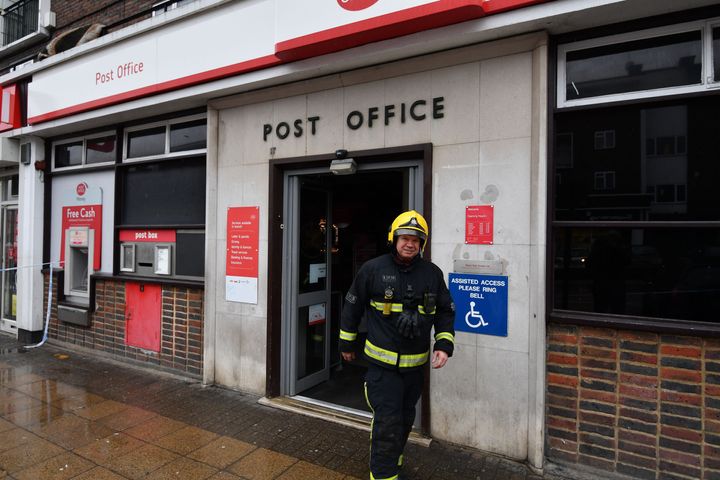 Firefighters outside the Post office in Harold Hill