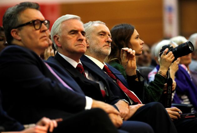 Tom Watson (left) and John McDonnell with Jeremy Corbyn at a Labour Party rally.