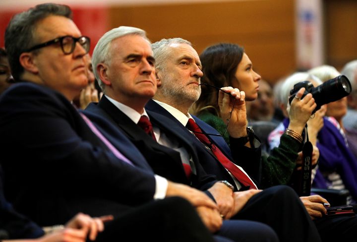 Tom Watson (left) and John McDonnell with Jeremy Corbyn at a Labour Party rally.