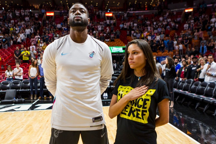 Dwyane Wade stands next to Andrea Ghersi, the sister of Joaquin Oliver, during the singing of the national anthem on Saturday